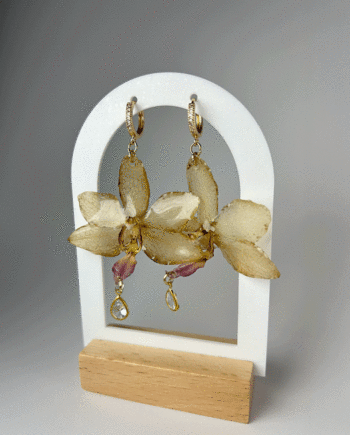 Preserved dark yellow orchid earring dipped in resin with zirconia stone.