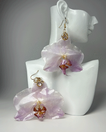 Preserved white and purple orchid earrings dipped in resin.