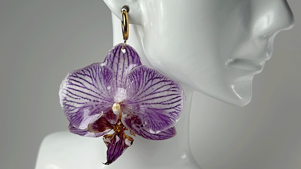 Purple Preserved orchid earring dipped in resin.